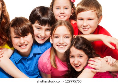 Close-up Of A Group Of 10 Years Old Kids, Boys And Girls, Hugging, Smiling, Laughing, On White