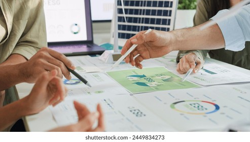 Closeup group Asia businesspeople talk ESG strategies risk management workshop, SDGs report, global warming, green finance investment eco friendly and net zero waste in boardroom training building. - Powered by Shutterstock