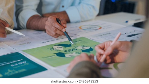 Closeup group Asia businesspeople talk ESG strategies risk management workshop night, SDGs, global warming, green finance and investment and net zero waste lifestyle in boardroom training building. - Powered by Shutterstock