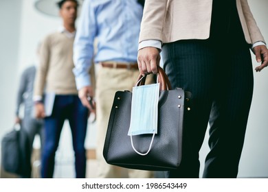 Close-up Of Group Of Business People Standing Six Feet Apart While Waiting In  Line Due To Coronavirus. Focus Is On Foreground. 

