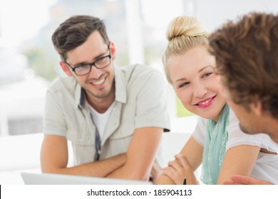 Closeup Of A Group Of Casual People Working In A Bright Office