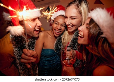 Close-up of a group of cheerful friends at New Year party in a festive atmosphere at home. Christmas, New Year, holiday, party - Powered by Shutterstock