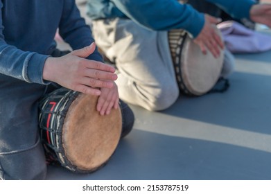 close-up group of people playing African drums. High quality photo