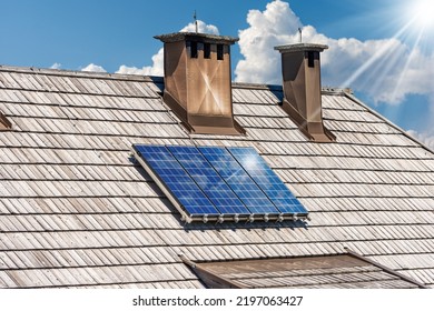 Close-up of a group of solar panels above the wooden roof of a chalet, Renewable Energies Concept. Austria, Europe. - Shutterstock ID 2197063427