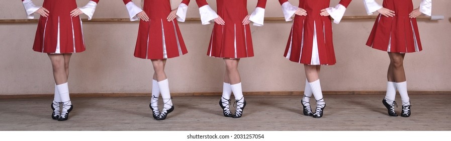 Close-up Of A Group Of Woman Dancing Traditional Irish Dances. Legs Of A Dance Ensemble