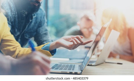 Closeup Group Young Coworkers Together Discussing Creative Project During Work Process.Modern Friends Business Meeting Discussion Startup Concept Office.Hipsters Hand Typing Laptop.Blurred,Flares