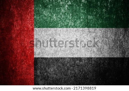 Closeup of grunge United Arab Emirates flag. Dirty United Arab Emirates flag on a metal surface.