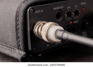 Close-up of guitar amplifier input jack with cable