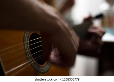 closeup guitar player