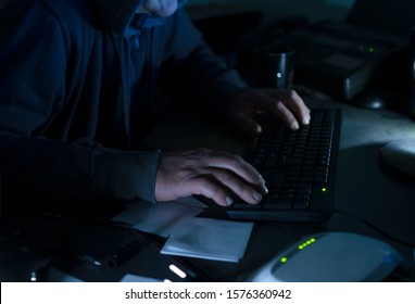 Closeup Of Hacker`s Hands On The Desk Keyboard, Different Devices On The Table At The Office.Concept Of Spying 