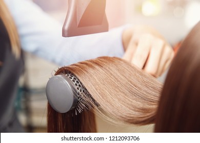 Close-up of hair dryer, concept cut salon, female stylist.
