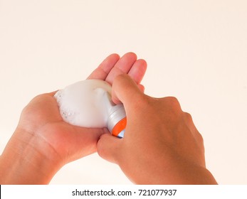 Closeup Hair Styling Mousse Foam On Hands Of Woman On White Background.