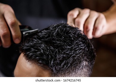 close-up haircut of a dark-haired guy. cinematic photography. - Shutterstock ID 1674216745
