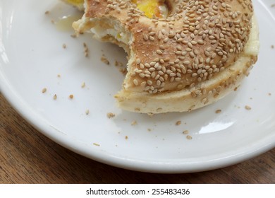 Closeup Of An Half Eaten Bagel Breakfast Sandwich.