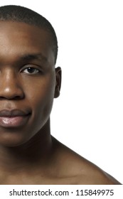 Close-up Half Face Of A Dark Man Against The White Background