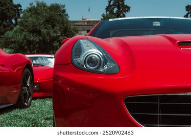Closeup half view from the front of a red car 