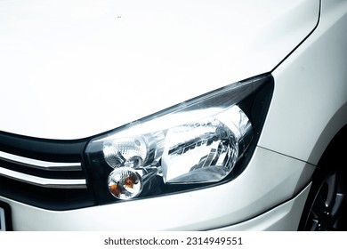 Close-up halogen head light. beauty clean headlights of white city car. - Shutterstock ID 2314949551