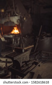 Close-up Of Hammer In Workshop, Furnace In The Background, Dark Space For Forging