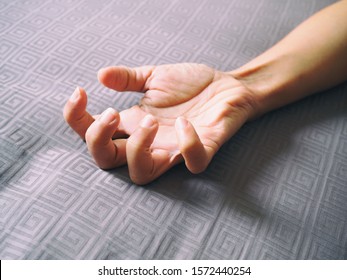 Close-up Hand Of Adult Asian With Flexing Fingers.