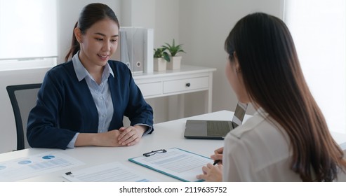 Close-up Hand Asia People Woman Fill Rent Loan Form Write Legal Debt Letter At Lawyer Home Office. Happy Female Life Buy Or Sell New House Deal From Real Estate Sale Agent. Tax Advice Talk And Smile.