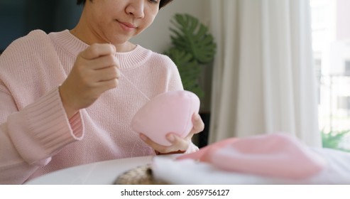 Close-up Hand Asia Woman Help Make Craft Pink Single Fill Up Bra Cup Insert For Post Mastectomy Prosthesis Surgery MRM At Home. Relief Work Service Support Give Hope To Tumor Patient Medical Issue.