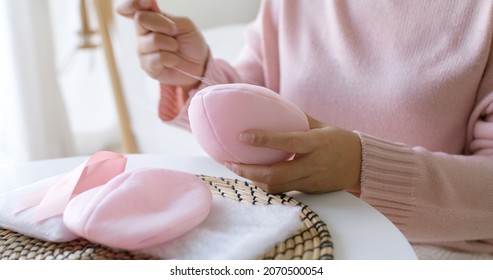 Close-up Hand Asia Woman Help Make Craft Pink Single Fill Up Bra Cup Insert For Post Mastectomy Prosthesis Surgery MRM At Home. Relief Work Service Support Give Hope To Tumor Patient Medical Issue.