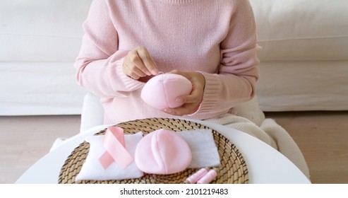 Close-up Hand Asia Woman Help Make Craft Pink Single Fill Up Bra Cup Insert For Post Mastectomy Prosthesis Surgery MRM At Home. Relief Work Service Support Give Hope To Tumor Patient Medical Issue.