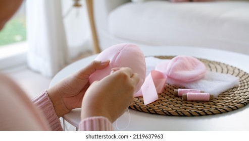 Close-up Hand Asia Woman Help Make Craft Pink Single Fill Up Bra Cup Insert For Post Mastectomy Prosthesis Surgery MRM At Home. Relief Work Service Support Give Hope To Tumor Patient Medical Issue.