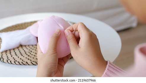 Close-up Hand Asia Woman Help Make Craft Pink Single Fill Up Bra Cup Insert For Post Mastectomy Prosthesis Surgery MRM At Home. Relief Work Service Support Give Hope To Tumor Patient Medical Issue.