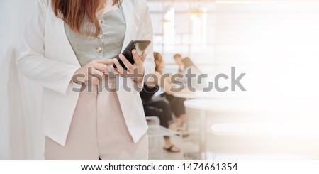 Closeup hand of  business woman on white clothes relaxtion in cafe and using smart phone,socialmedia, technololy online,working Freelance Concept, with copy space for your text 