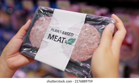 Close-up Hand Carry Choose Zero Pork Soy Bean Faux Peas Cutlet Gluten Free Read Beyond Non-meat Lab Label. Buy Raw Fake Beef Tray In Asia Store Veggie Burger Patty For Health Care Eat Diet Meal Cook.