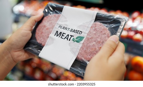 Close-up Hand Carry Choose Zero Pork Soy Bean Faux Peas Cutlet Gluten Free Read Beyond Non-meat Lab Label. Buy Raw Fake Beef Tray In Asia Store Veggie Burger Patty For Health Care Eat Diet Meal Cook.