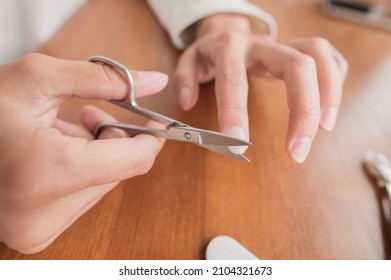 Close-up Of Hand Of Caucasian Young Woman Doing Manicure At Home With Nail Supplies.