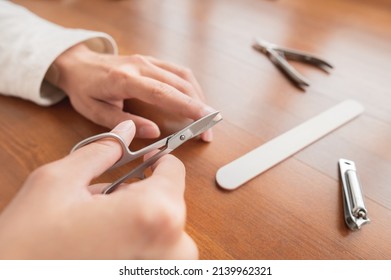 Close-up Of Hand Of Caucasian Young Woman Doing Manicure At Home With Nail Supplies.