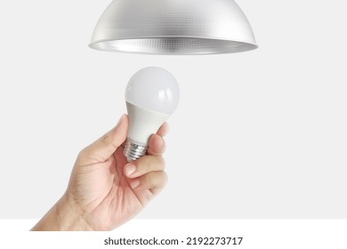 Closeup Of Hand To Change LED Bulbs