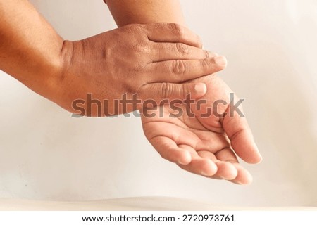 Close-Up of Hand Checking Pulse on Wrist