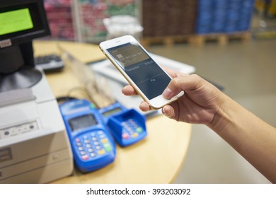 closeup of hand completing mobile payment - Shutterstock ID 393203092