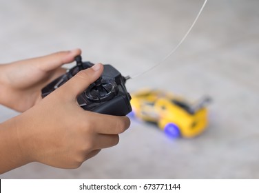 Close-up Hand Control Kids Car With Radio Remote Control On Holding A Transmitter