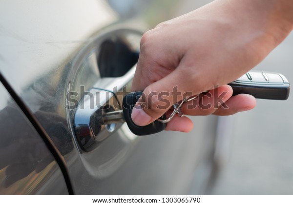 Closeup Hand Holding Car Keys Unlock Stock Photo Edit Now 1303065790