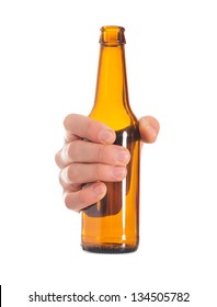Close-up Of Hand Holding Empty Beer Bottle On White Background
