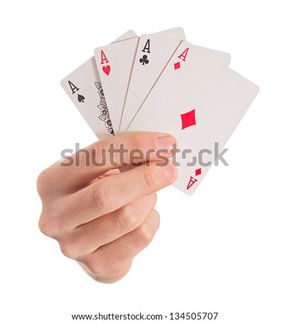Close-up Of Hand Holding Four Aces On White Background