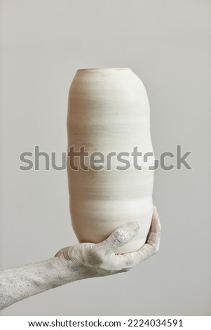Similar – Image, Stock Photo Hand holding a handmade hairpin with miniature clay cookie
