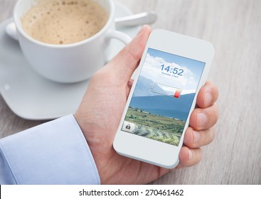 Close-up Of Hand Holding Mobile Phone With Low Battery