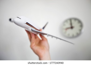 Close-up Of Hand Holding Model Airplane