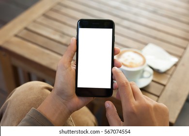 close-up hand holding phone mobile blank screen and finger touching in coffee shop - Powered by Shutterstock