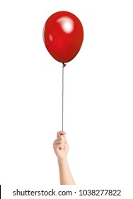 Close-up Of Hand Holding Red Balloon Over White Background