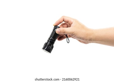 Closeup Of Hand Holding Small Black Flashlight Isolated On White Background