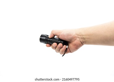 Closeup Of Hand Holding Small Black Flashlight Isolated On White Background