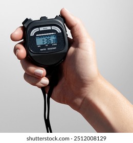 Closeup of hand holding stopwatch