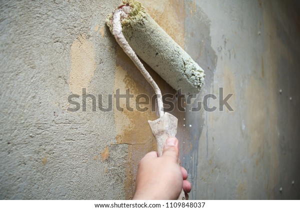 Closeup Hand Holds Rolling Paint Brush Stock Photo Edit Now